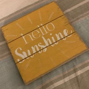 Yellow wood slates “Hello Sunshine” wall decor.